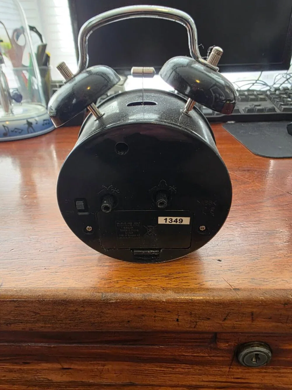 IKEA BLACK WIND UP CLOCK WITH BELLS ON TOP OF CLOCK
